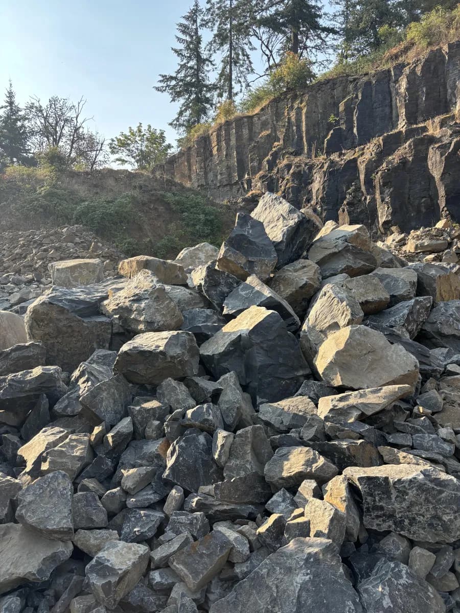 Liberty Rock Products yard with crushed rock and gravel piles